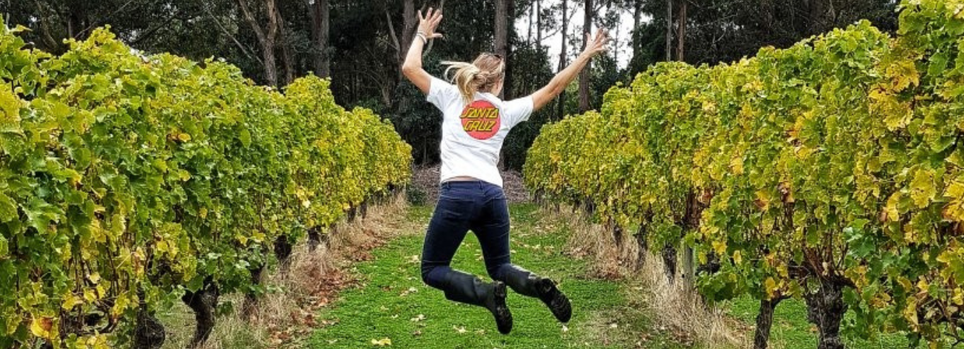 Jumpshot of a woman in South by South West vineyard